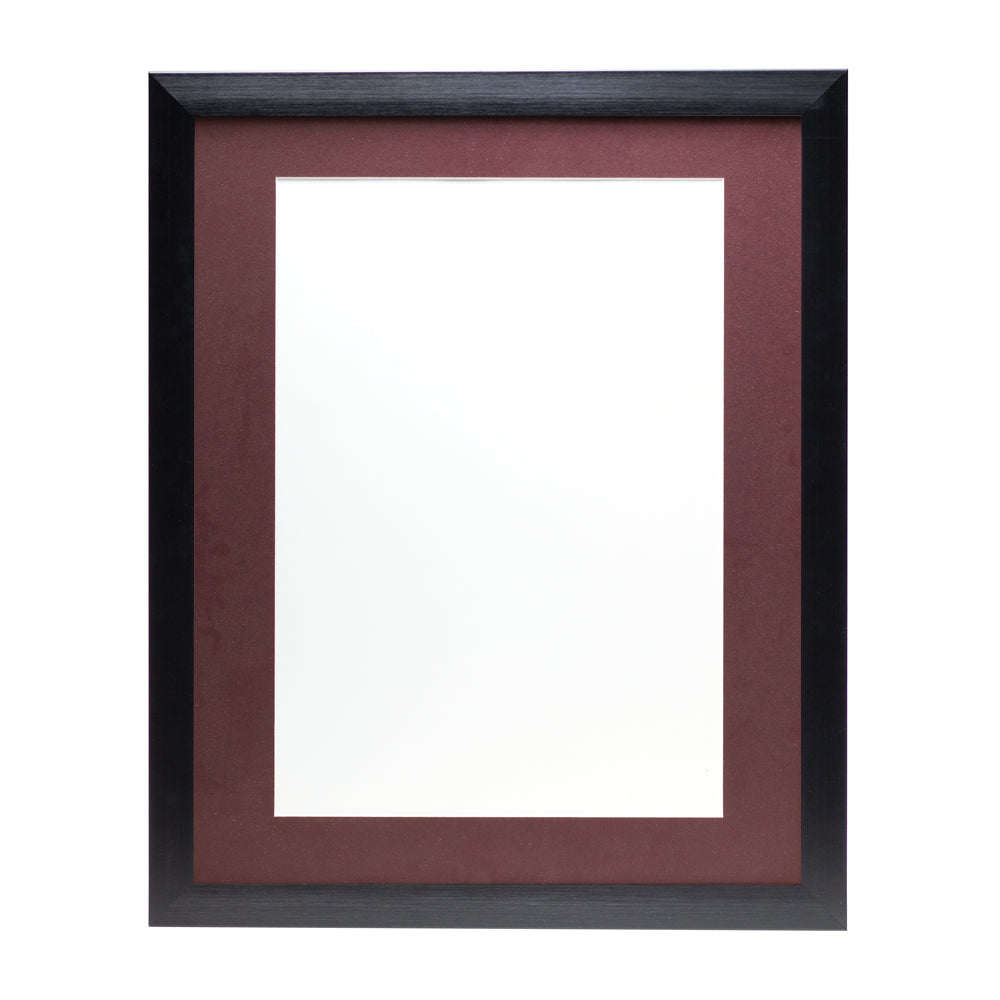 A black wooden frame with a burgundy red pre-cut framing matt.