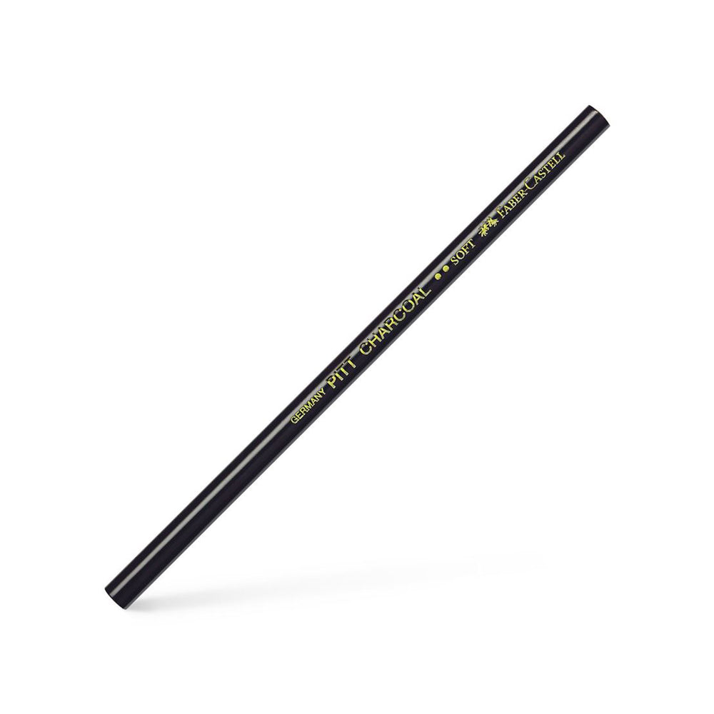 A soft, unsharpened Faber-Castell PITT charcoal pencil.