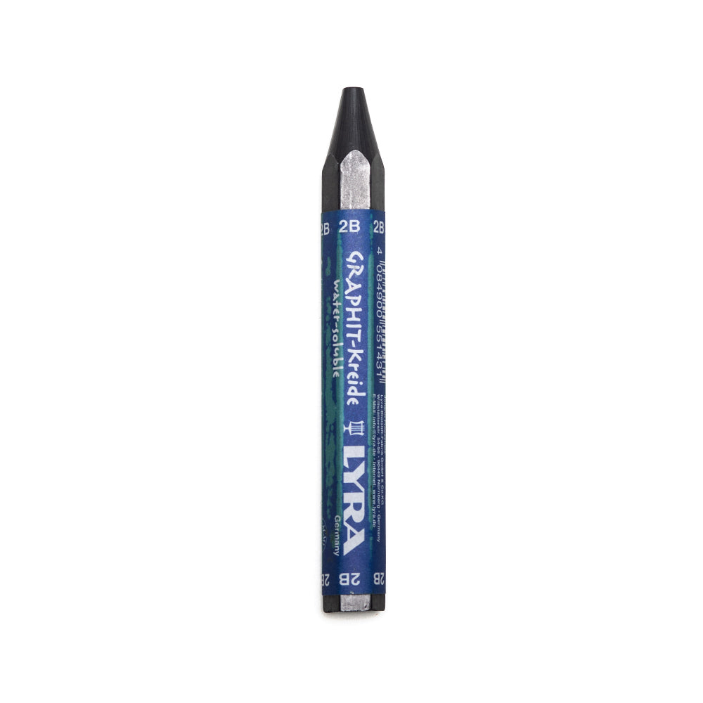 A 2B Lyra water soluble graphite stick. The stick is sharpened to a point and hexagonal in shape with a paper wrapper around the main body.
