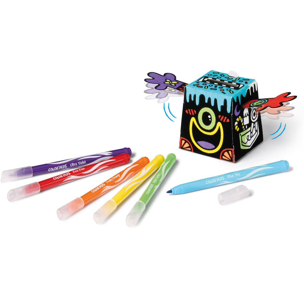 An assembled money box with markers in violet, red, orange, yellow, green and blue.