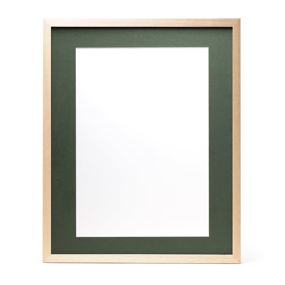 A wooden frame with natural stain finish and a dark green pre-cut framing matt.