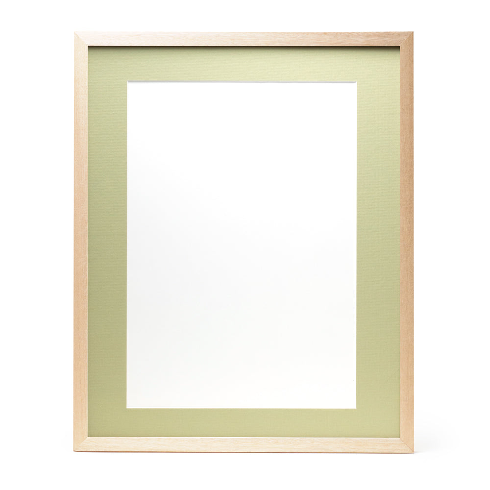 A wooden frame with natural stain finish and a light green pre-cut framing matt.
