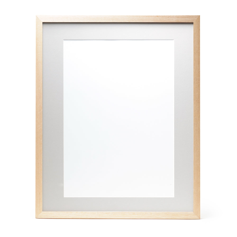 A wooden frame with natural stain finish and a light grey pre-cut framing matt.