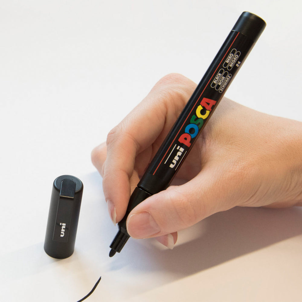 A fine line drawn with the black Uni Posca PC-1M fine bullet tip marker.