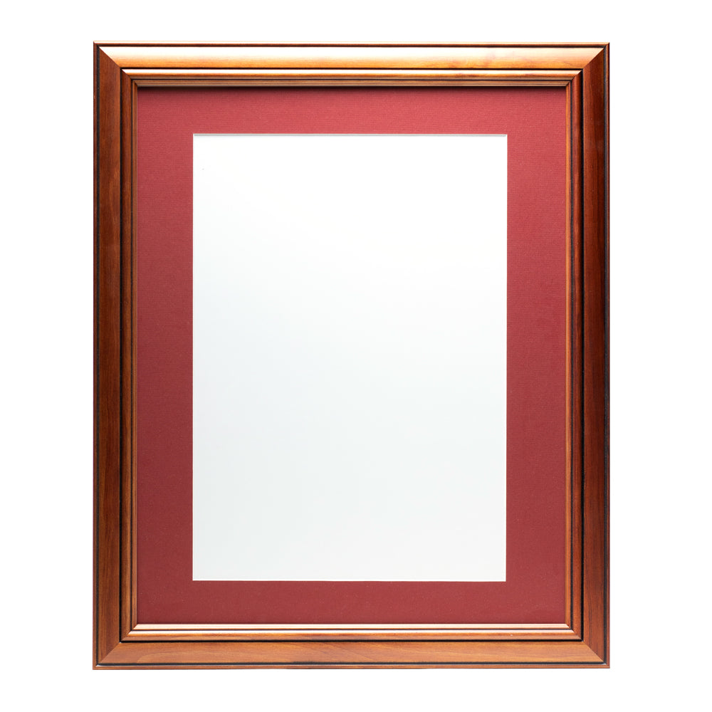 A wooden frame with walnut stain finish, bevelled edges and a deep red pre-cut framing matt.