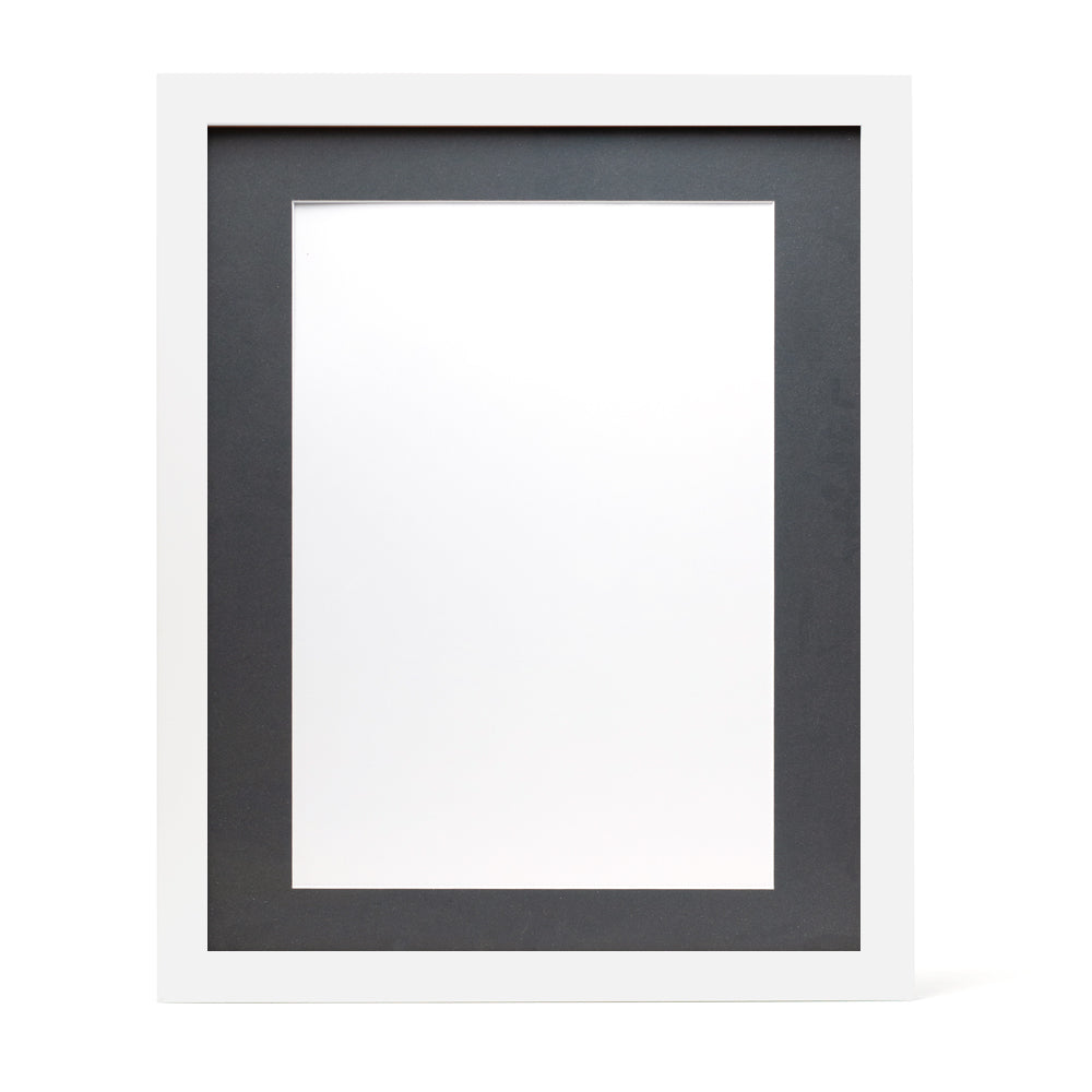 A white wooden frame with a dark grey pre-cut framing matt.