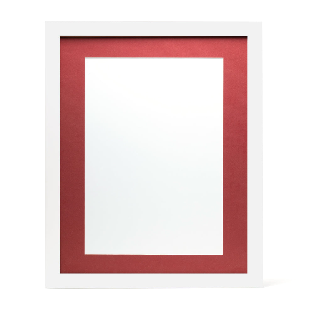 A white wooden frame with a deep red pre-cut framing matt.