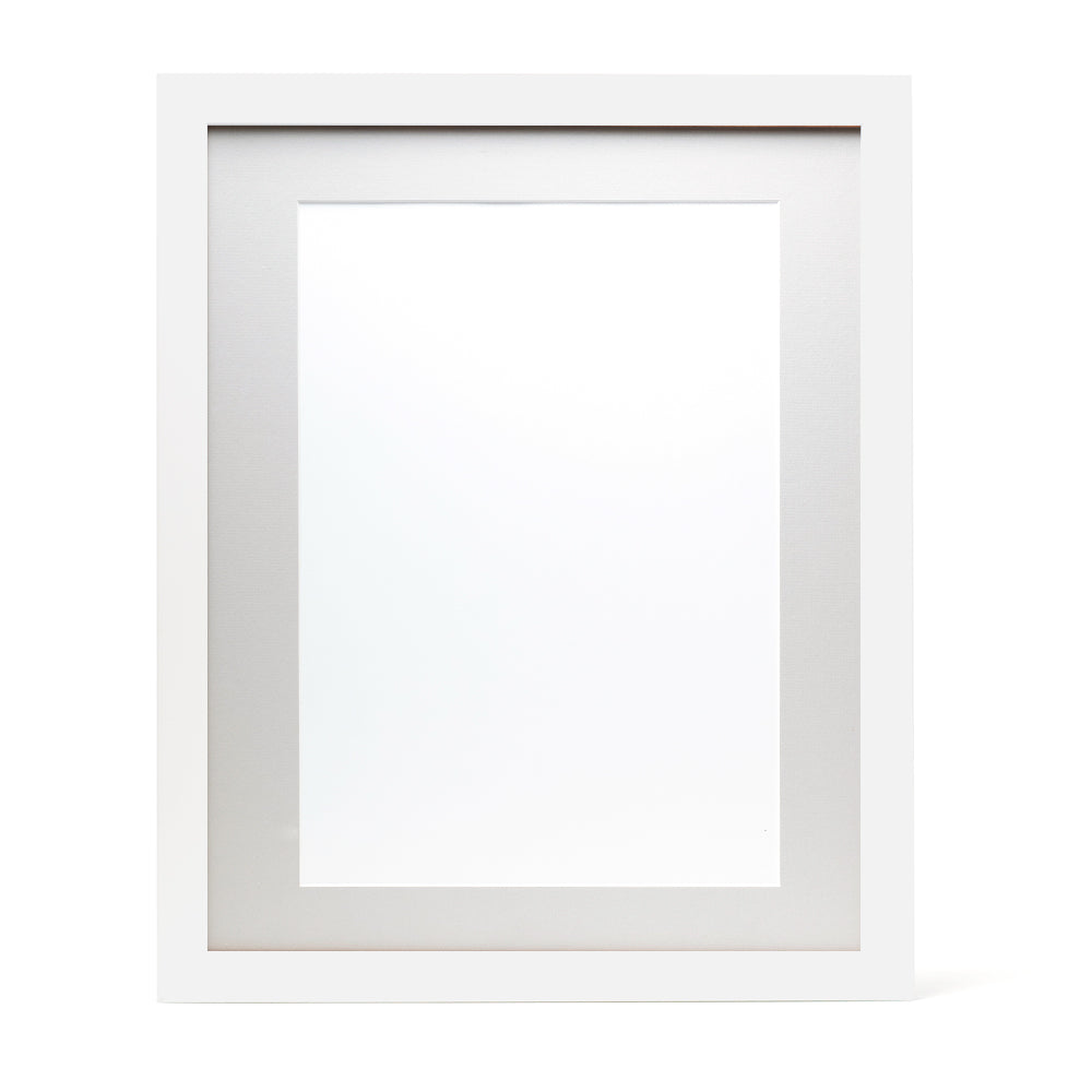 A white wooden frame with a light grey pre-cut framing matt.