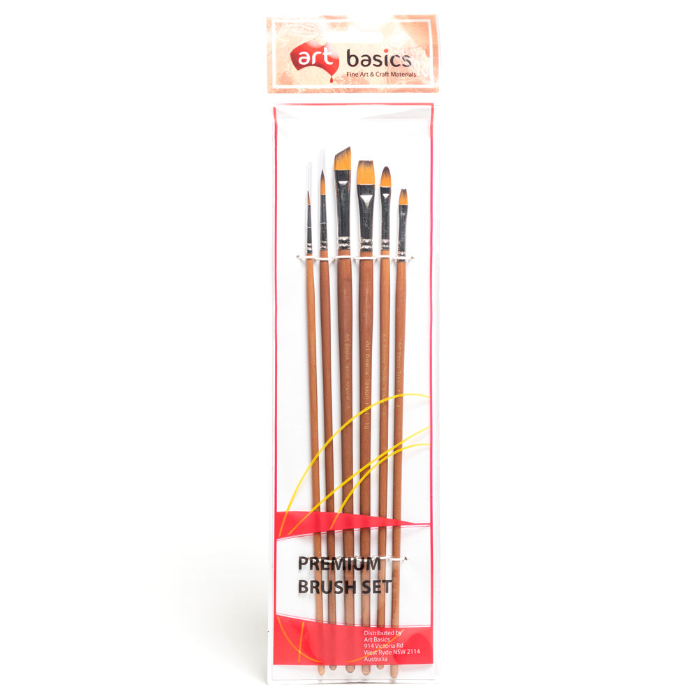 A packet of six assorted brushes on long wooden handles. Packet contains one number 0 round brush, one number 4 round brush, one number 4 angular brush, one number 4 flat brush, one number 10 flat brush and one number 6 filbert brush