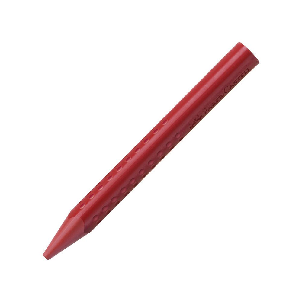 A red Faber-Castell erasable wax crayon with indentations on each of the three sides for grip.