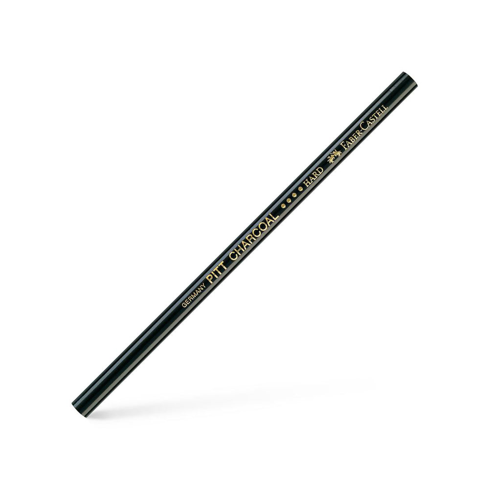A hard, unsharpened Faber-Castell PITT charcoal pencil.