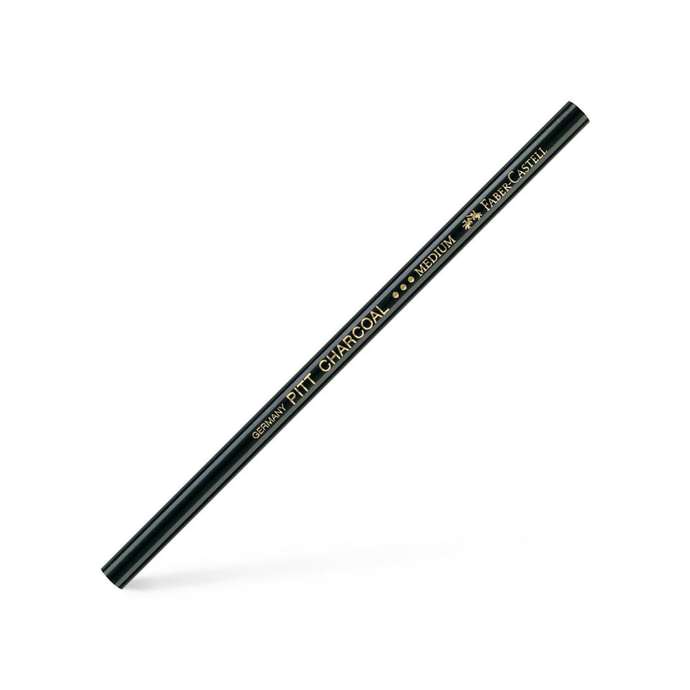 A medium, unsharpened Faber-Castell PITT charcoal pencil.