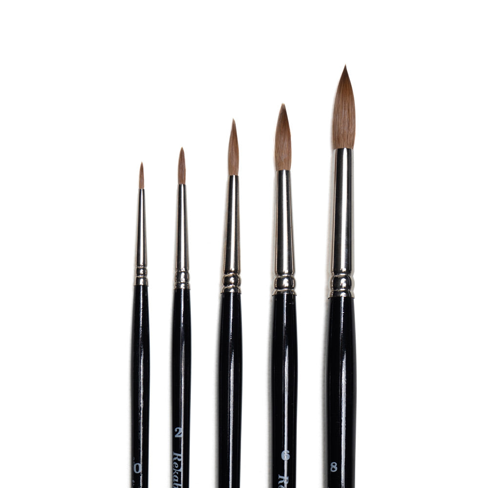 Rekab kolinsky sable round brushes in multiple sizes with rounded bristles that come to pointed tips.