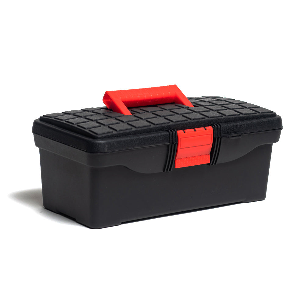 Artists’ tool box made from black polypropylene with a smooth base and a raised grid pattern on the lid. The hinged lid features a red fold out carry handle and a single red locking clip.